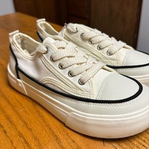 White shoes with black stripe